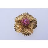 18ct gold and ruby chrysanthemum brooch, centred with a pistil of round cut rubies within a textured