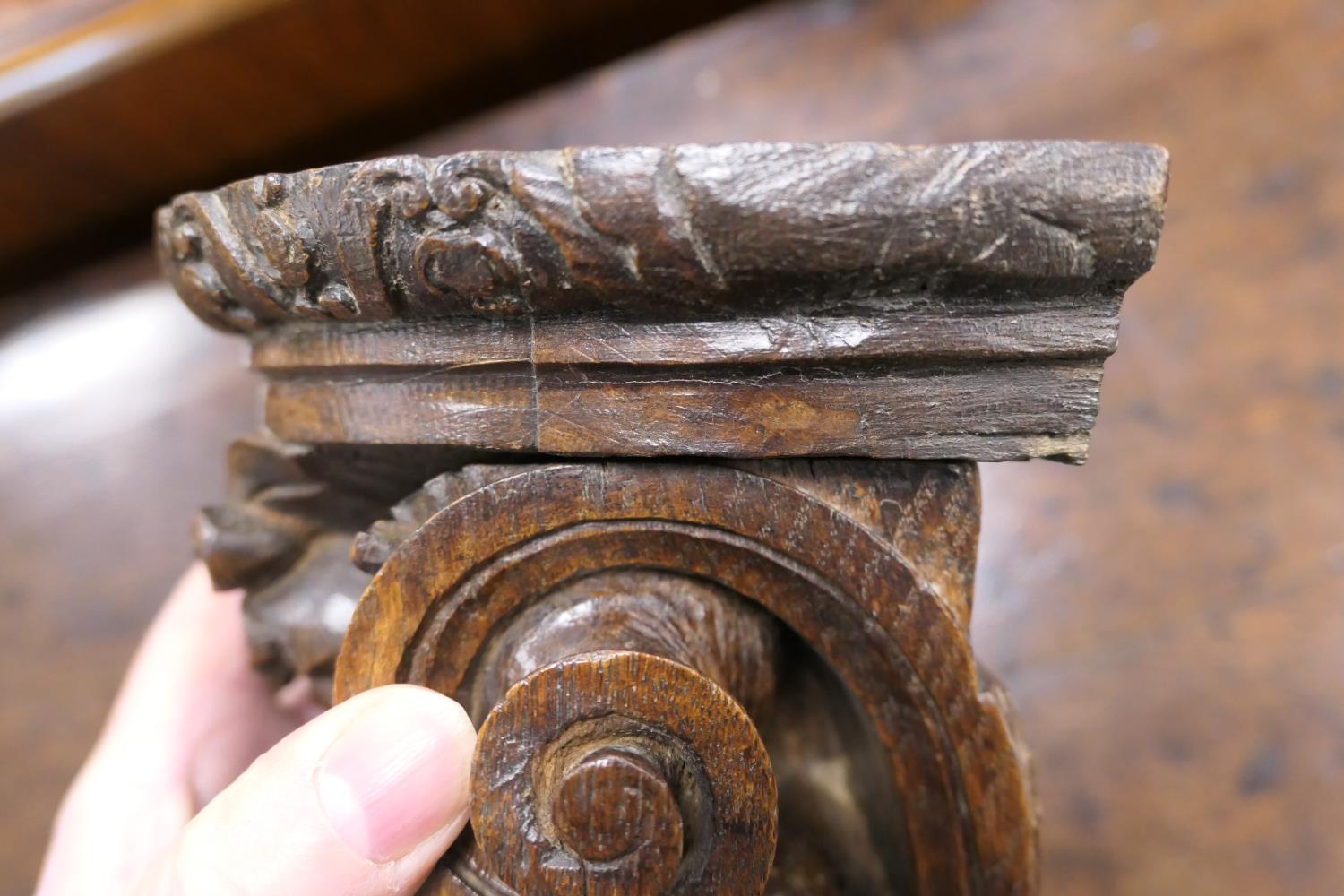 Late 17th Century carved oak bracket, carved with a grotesque mask and paper scroll, 22cm x 16. - Image 7 of 7