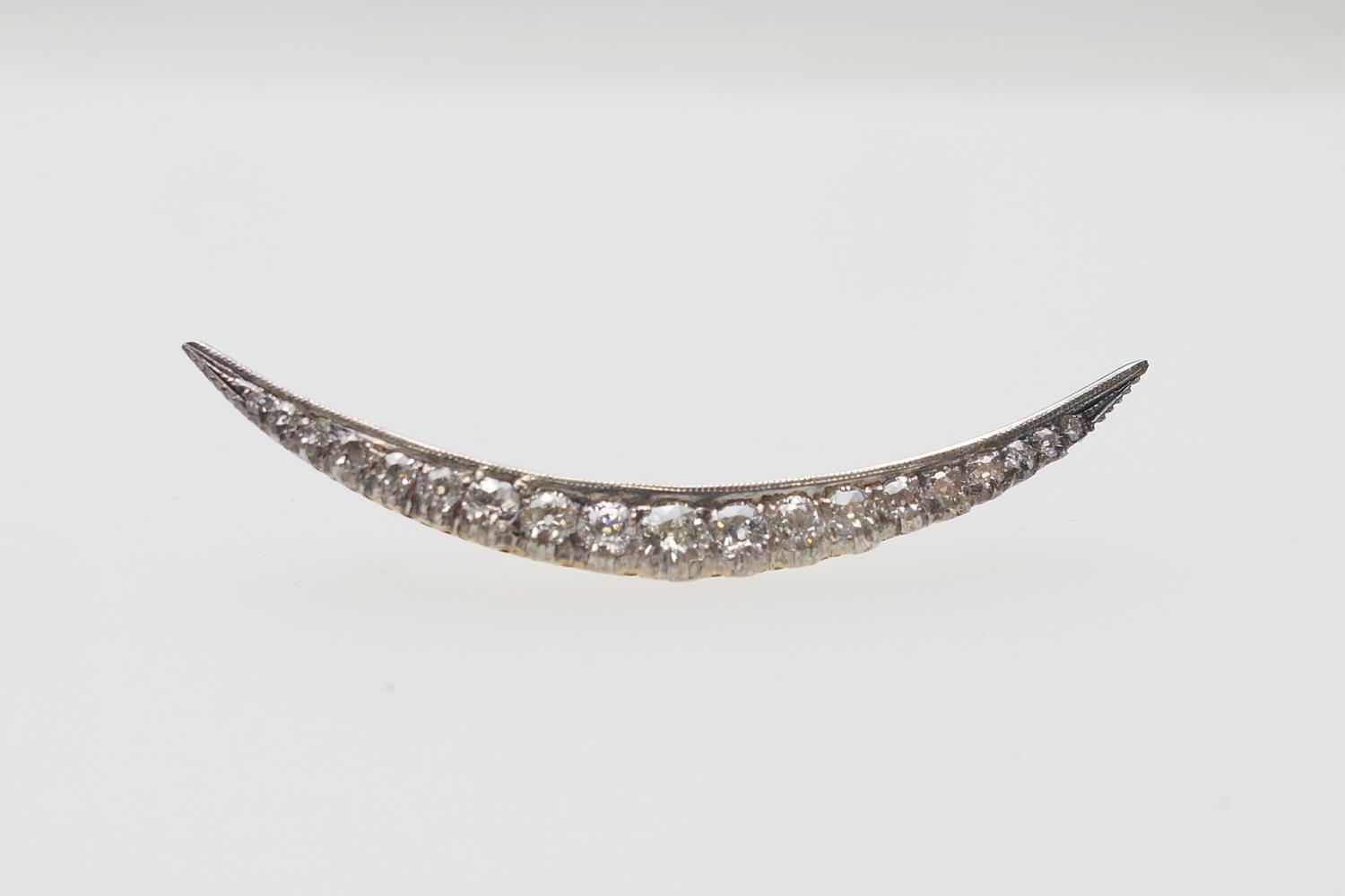 Diamond crescent brooch, set with nineteen old round cut diamonds, the largest centre stone of - Image 2 of 2