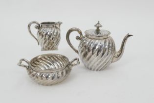 Dutch 833 standard silver three piece tea service, early 20th Century, comprising wrythen bullet