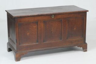 George III oak and inlaid linen box, circa 1790, three plank top over a three recessed panel front