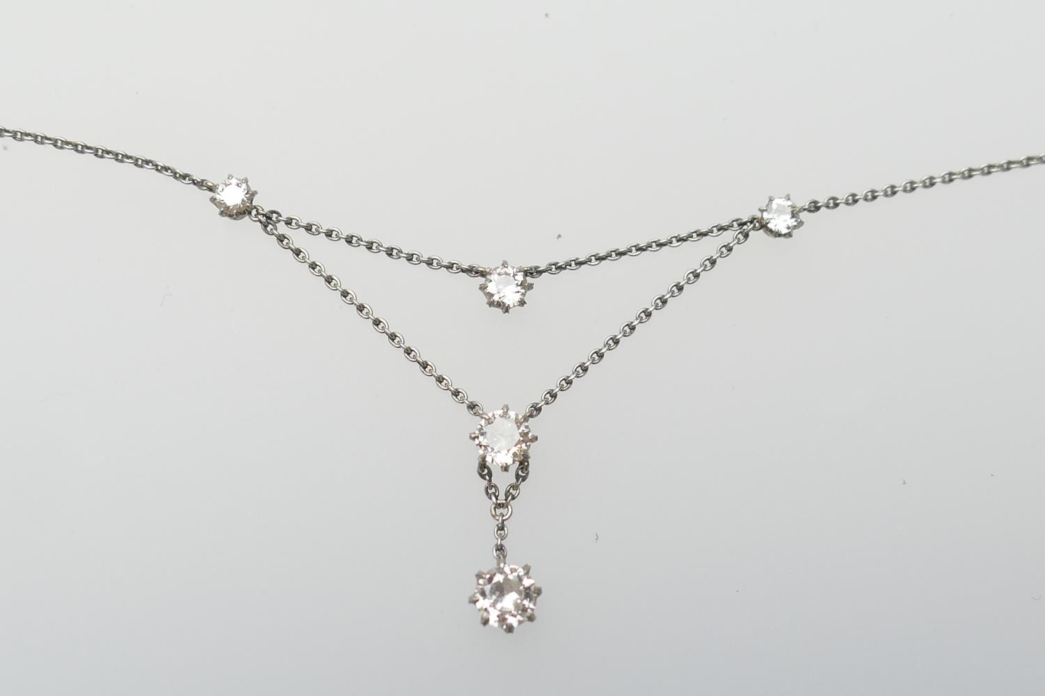 Diamond pendant necklace, centred with an old round cut diamond of approx. 0.5ct, suspended