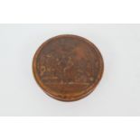 Pressed burr wood circular snuff box, 19th Century, the cover decorated with a scene of revellers,