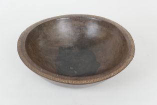 Treen dairy or grain bowl, the edge with simplistic carved chevron decoration, 38.5cm diameter (