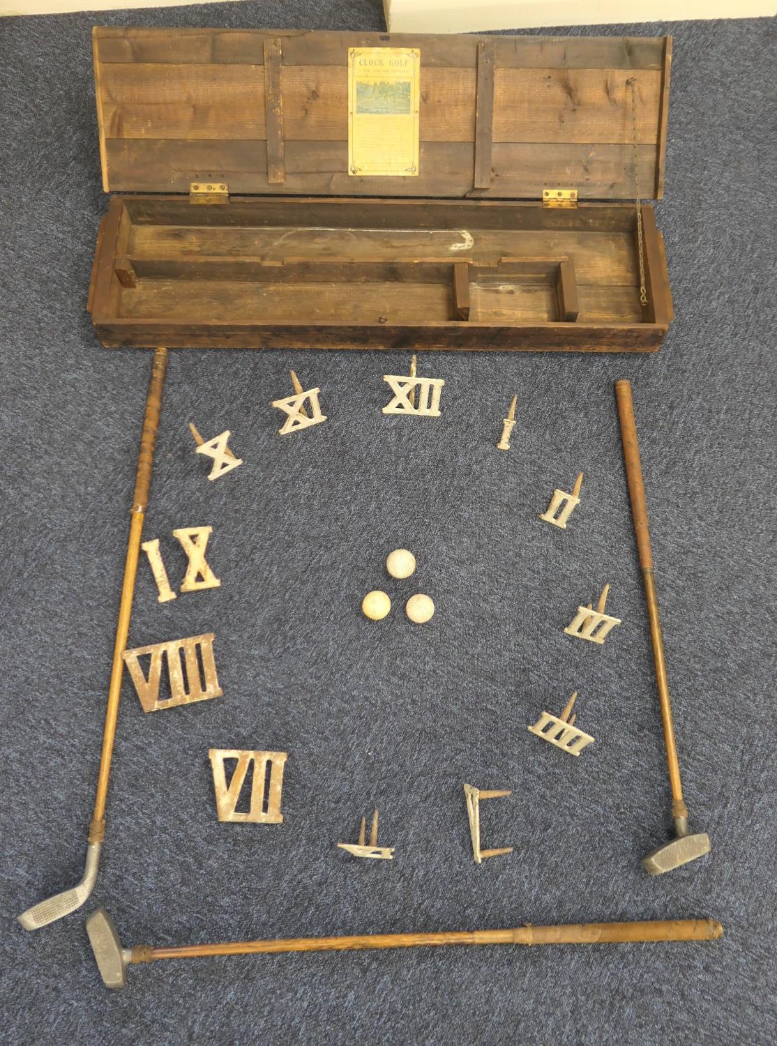 Clock golf set, boxed, with cast iron Roman numerals, three aluminium headed adapted hickory shafted