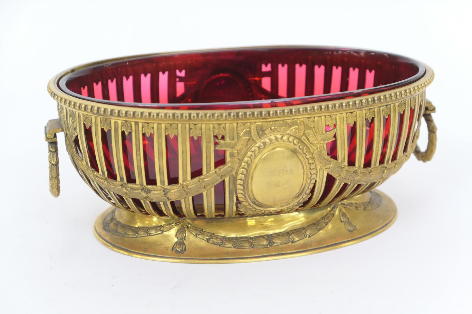 Martin Hall & Co. gilt metal table bowl in the Adam style, early 20th Century, oval form with red