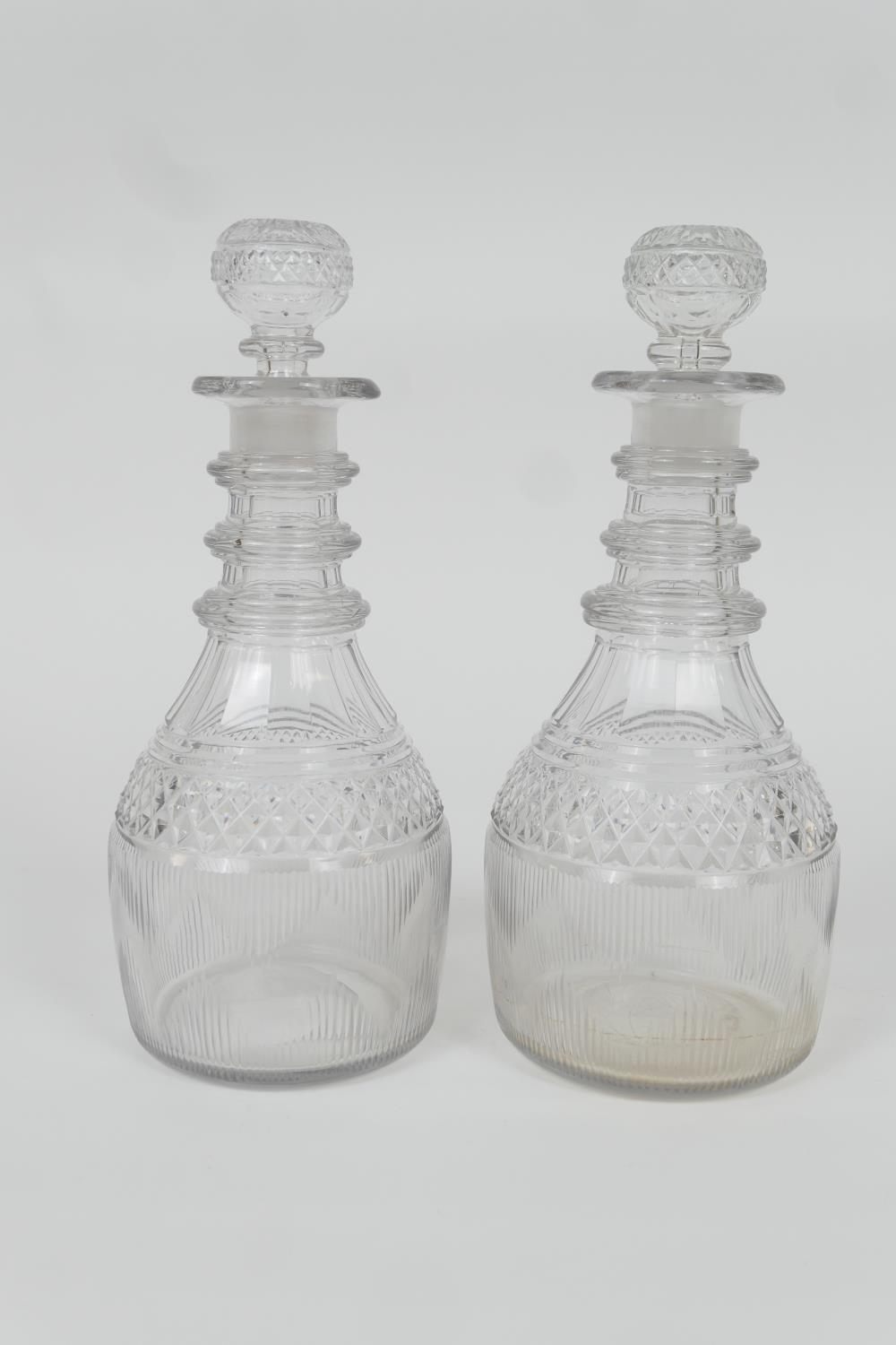 Pair of Regency cut glass triple ring neck mallet shaped decanters, circa 1820, height 26cm (