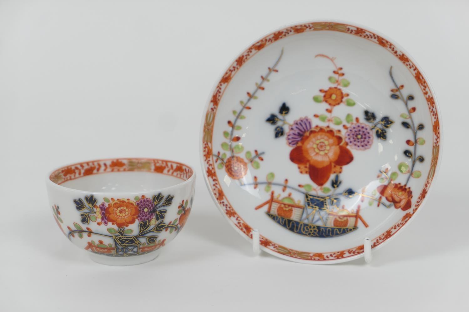 Meissen tea bowl and saucer, 18th Century, decorated in Imari palette, blue crossed swords mark (