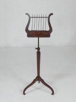 Mahogany and inlaid adjustable music stand, probably Dutch, 19th Century, the lyre shaped adjustable