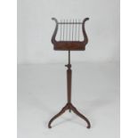 Mahogany and inlaid adjustable music stand, probably Dutch, 19th Century, the lyre shaped adjustable