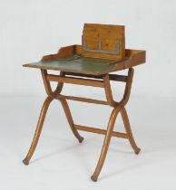 Victorian oak coaching or campaign writing table, having a folding top on a cross stretcher base,
