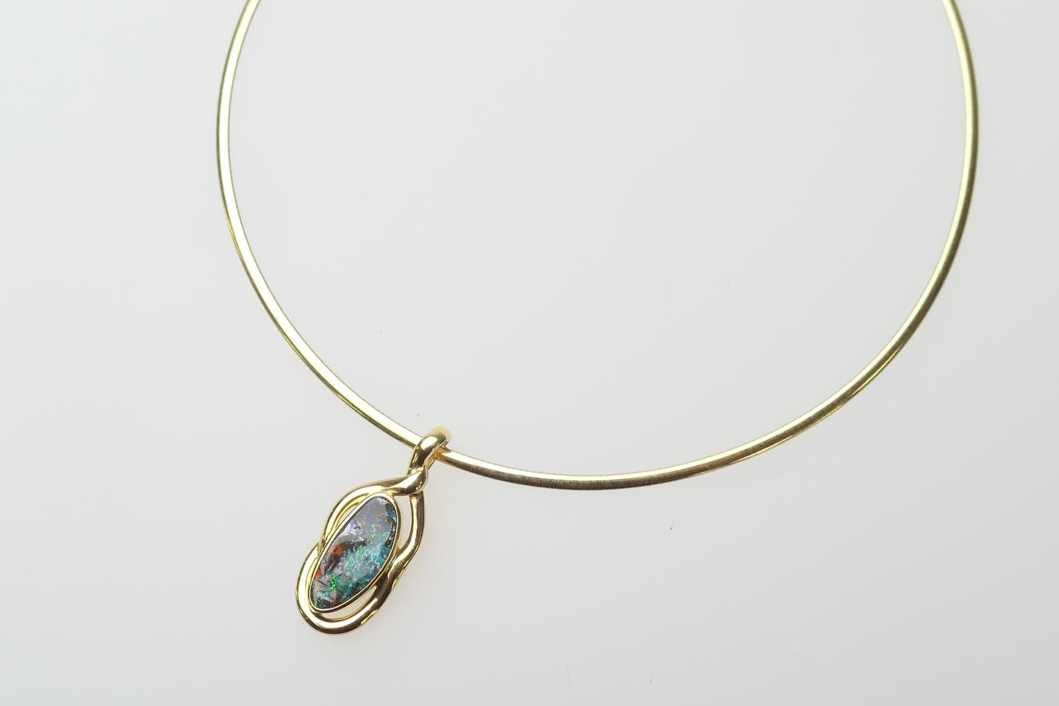 Doublet opal pendant necklace, the irregular shaped opal within an 18ct yellow gold pendant mount,