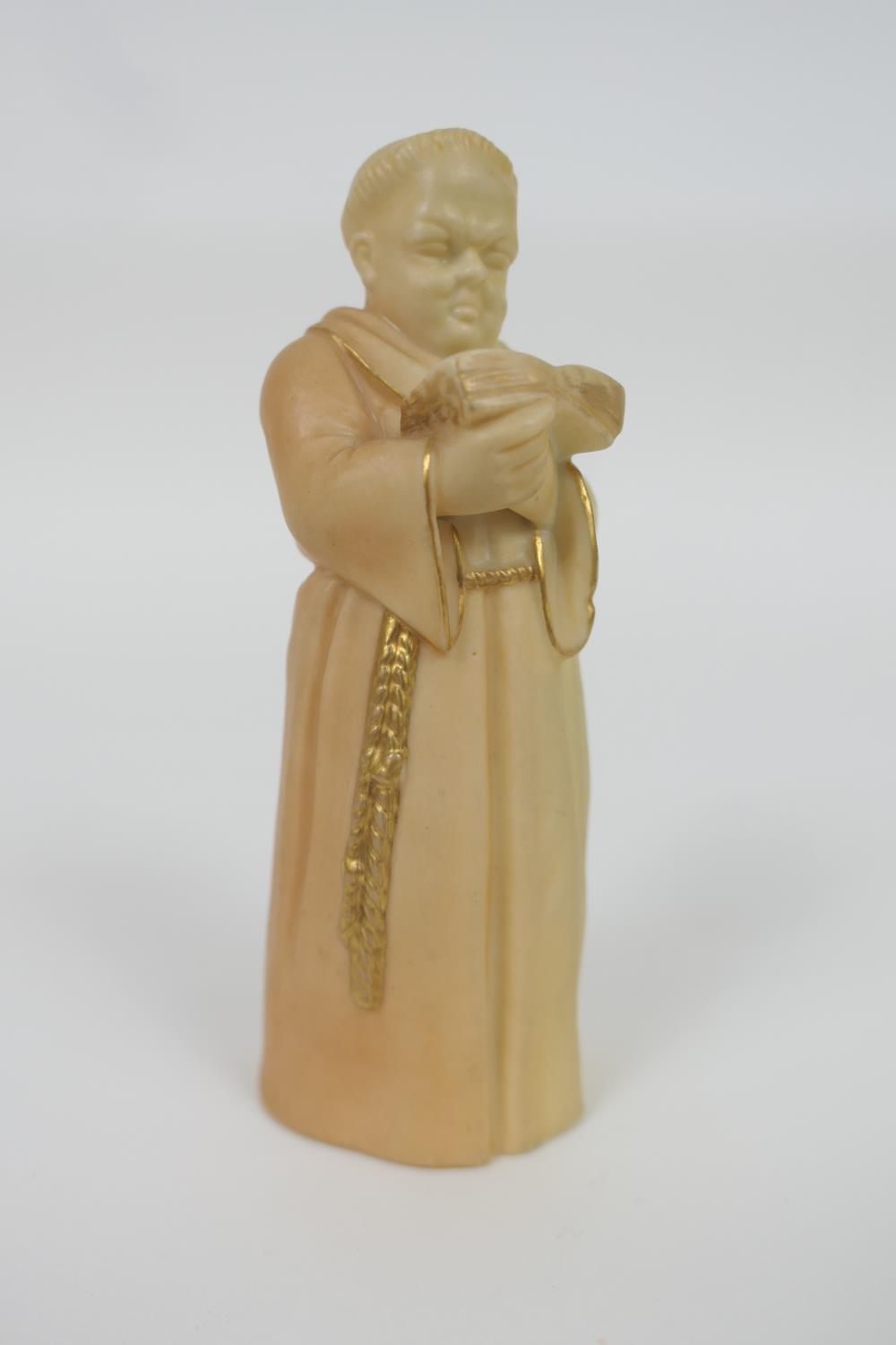 Royal Worcester peach ground candle snuffer, modelled as a friar, circa 1916, 13cm (Please note