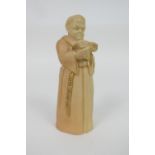 Royal Worcester peach ground candle snuffer, modelled as a friar, circa 1916, 13cm (Please note