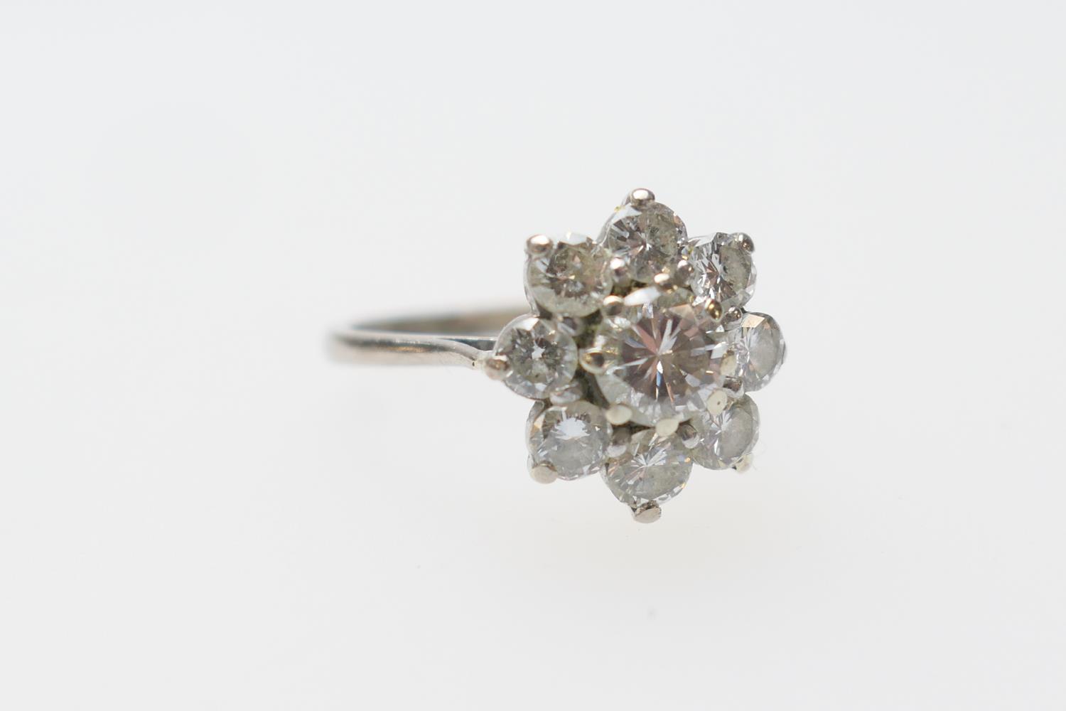 Diamond cluster ring, the central round cut diamond of approx. 0.95ct, estimated as K/L in colour