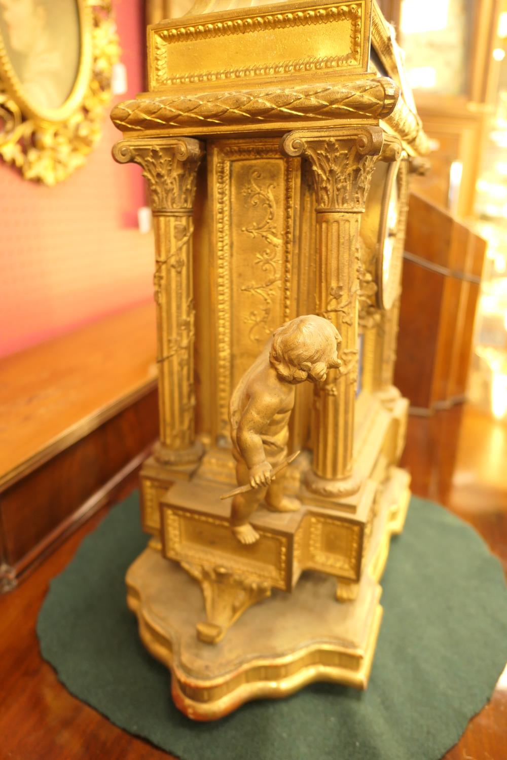 French gilt ormolu mantel clock, late 19th Century, surmounted with cherubs holding a flaming urn, - Image 4 of 4