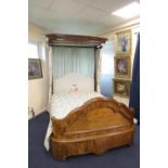 Victorian mahogany half tester bed, circa 1870, having a moulded canopy, upholstered headboard and