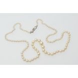 Cultured pearl choker necklace, the graduated pearls united by a 9ct white gold clasp centred with a