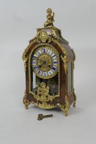 French boulle mantel clock, circa 1880, the case surmounted with a cherub and gilt ormolu