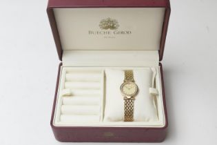 Bueche Girod 9ct gold lady's quartz wristwatch, champagne coloured dial with baton numerals, the