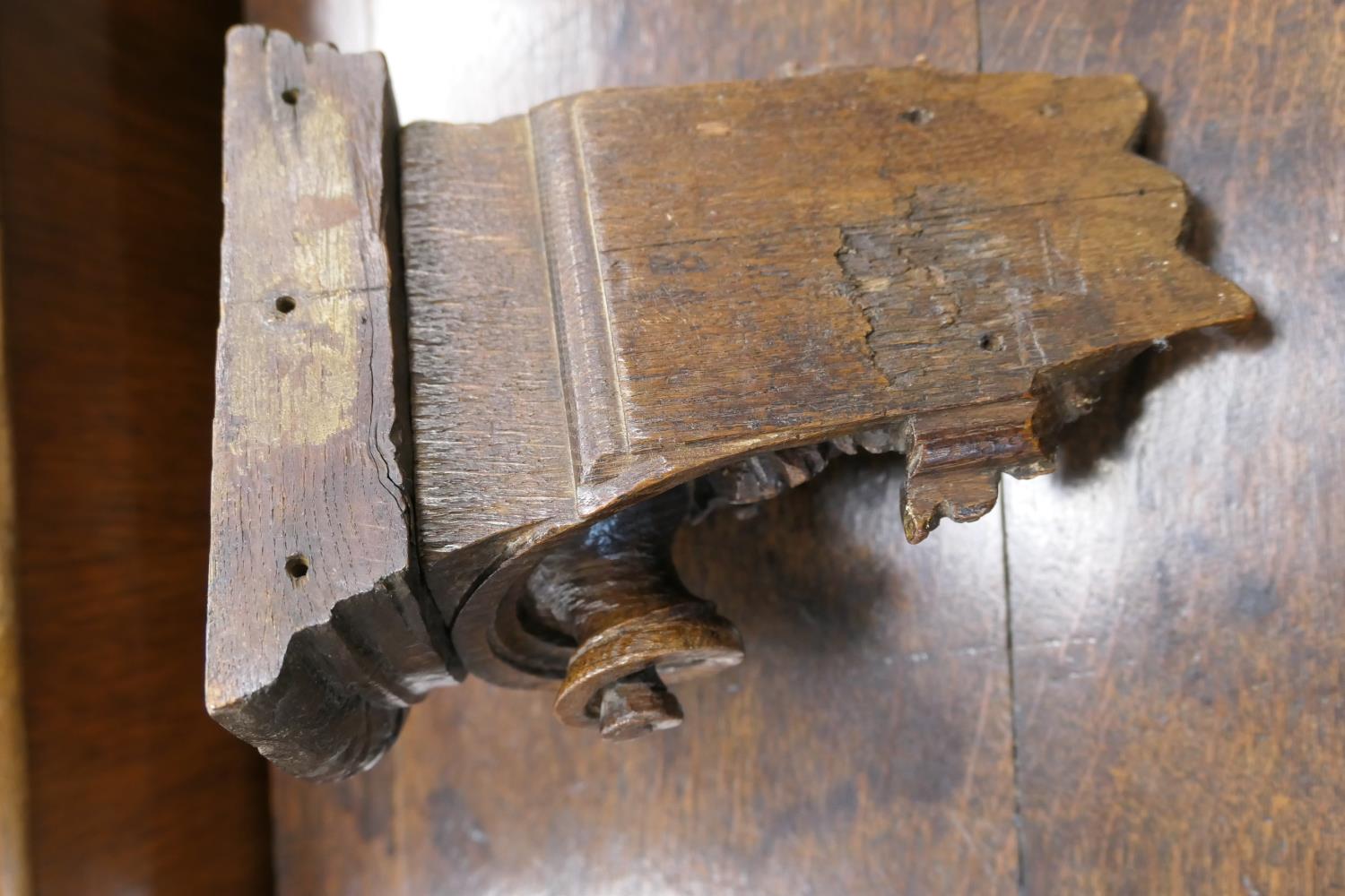 Late 17th Century carved oak bracket, carved with a grotesque mask and paper scroll, 22cm x 16. - Image 6 of 7