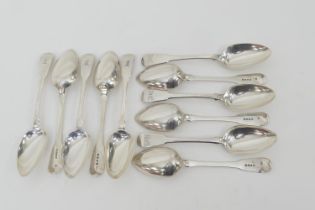 Eleven silver fiddle pattern table spoons, comprising seven George III by William Eley and William