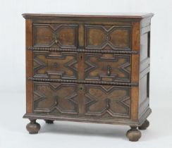 Oak moulded chest of drawers, in the Jacobean style, fitted with two short and two long drawers with