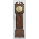 Wilson of Kendal, provincial oak eight day longcase clock, the hood with central brass urn finial,