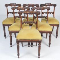 Good set of six George IV goncalo alves dining chairs, circa 1825, the top rails carved with