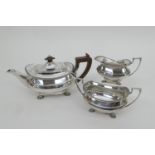 George VI silver three piece tea service, maker GH, Sheffield 1937, comprising teapot of bombe