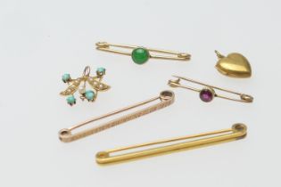 Manchester Swimming Club 1909 bar brooch, weight approx. 1.9g; also another 9ct gold bar brooch, 2.