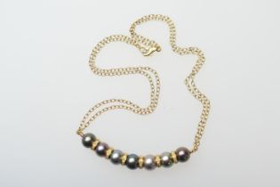 Black pearl and diamond choker necklace, in 18ct yellow gold, set with seven grey coloured pearls,