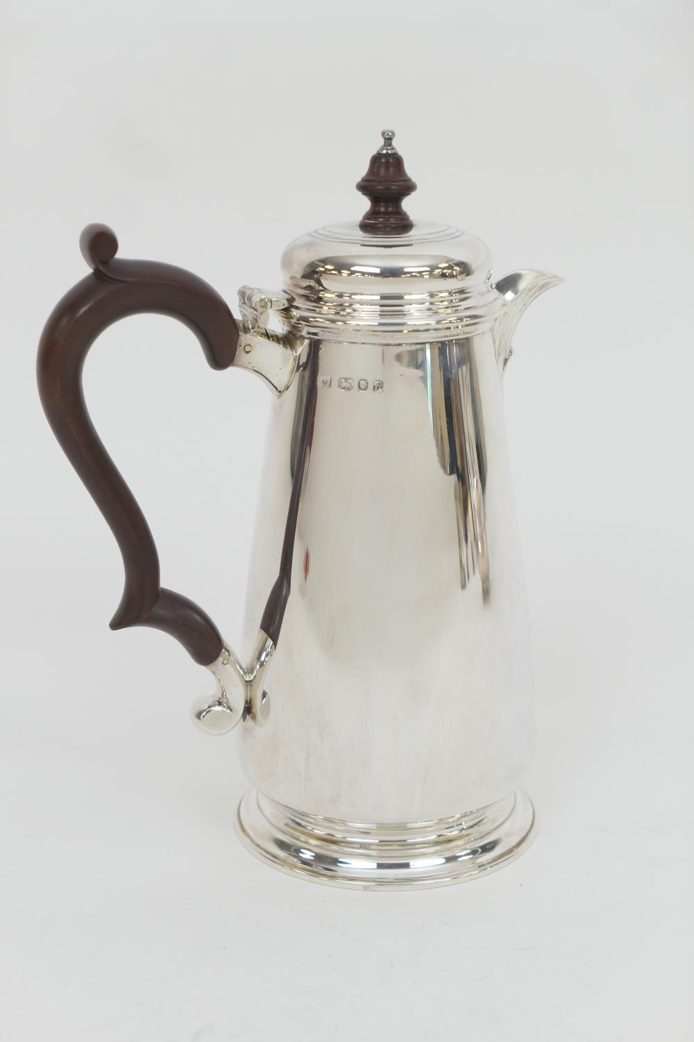 Elizabeth II silver hot water jug, maker R C, London 1979, hinged cover with turned wooden finial