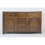 George III oak enclosed dresser, late 18th Century, fitted with three frieze drawers over three