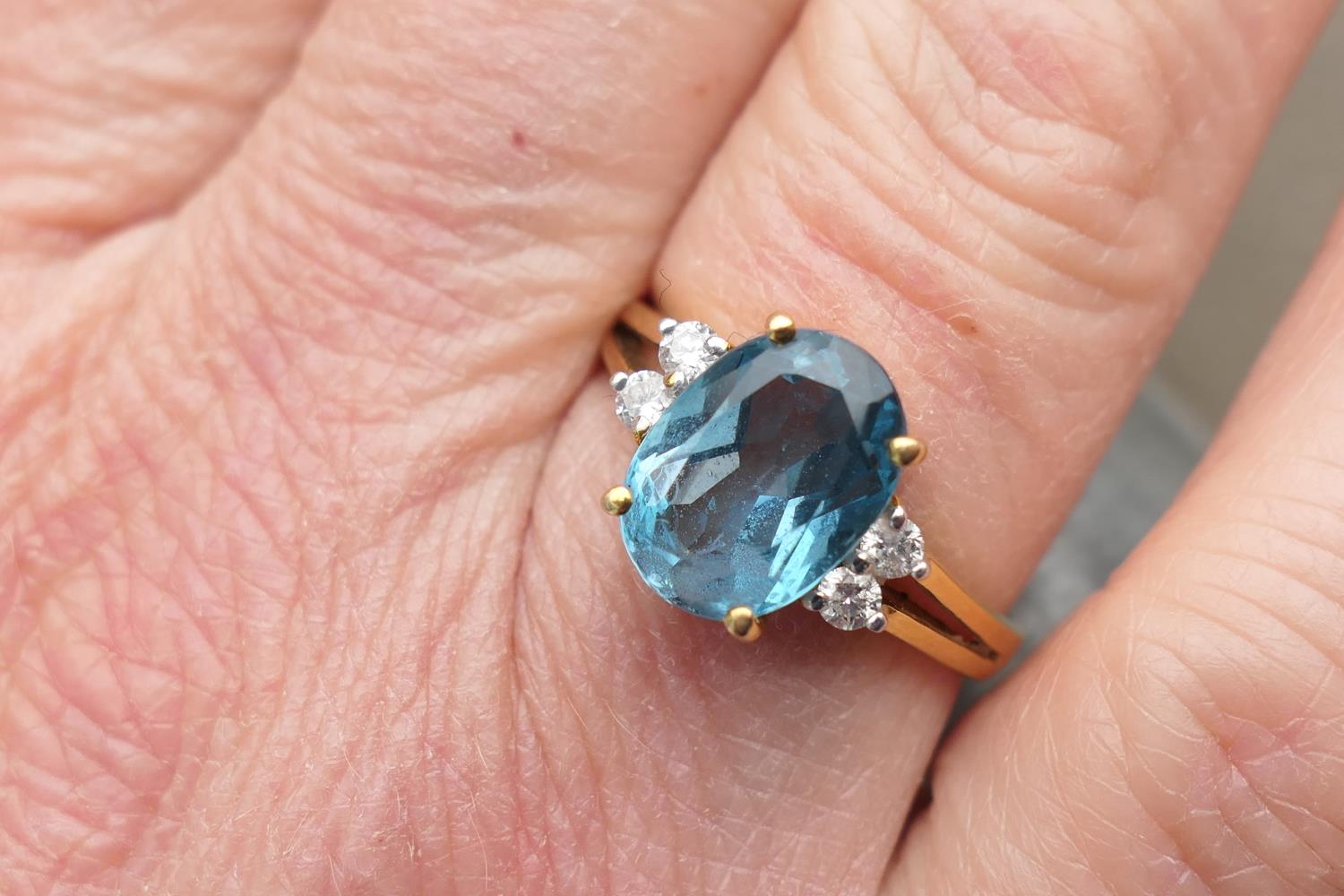 Diamond and blue zircon dress ring, the central oval cut stone of approx. 3cts, bordered with four - Image 4 of 7