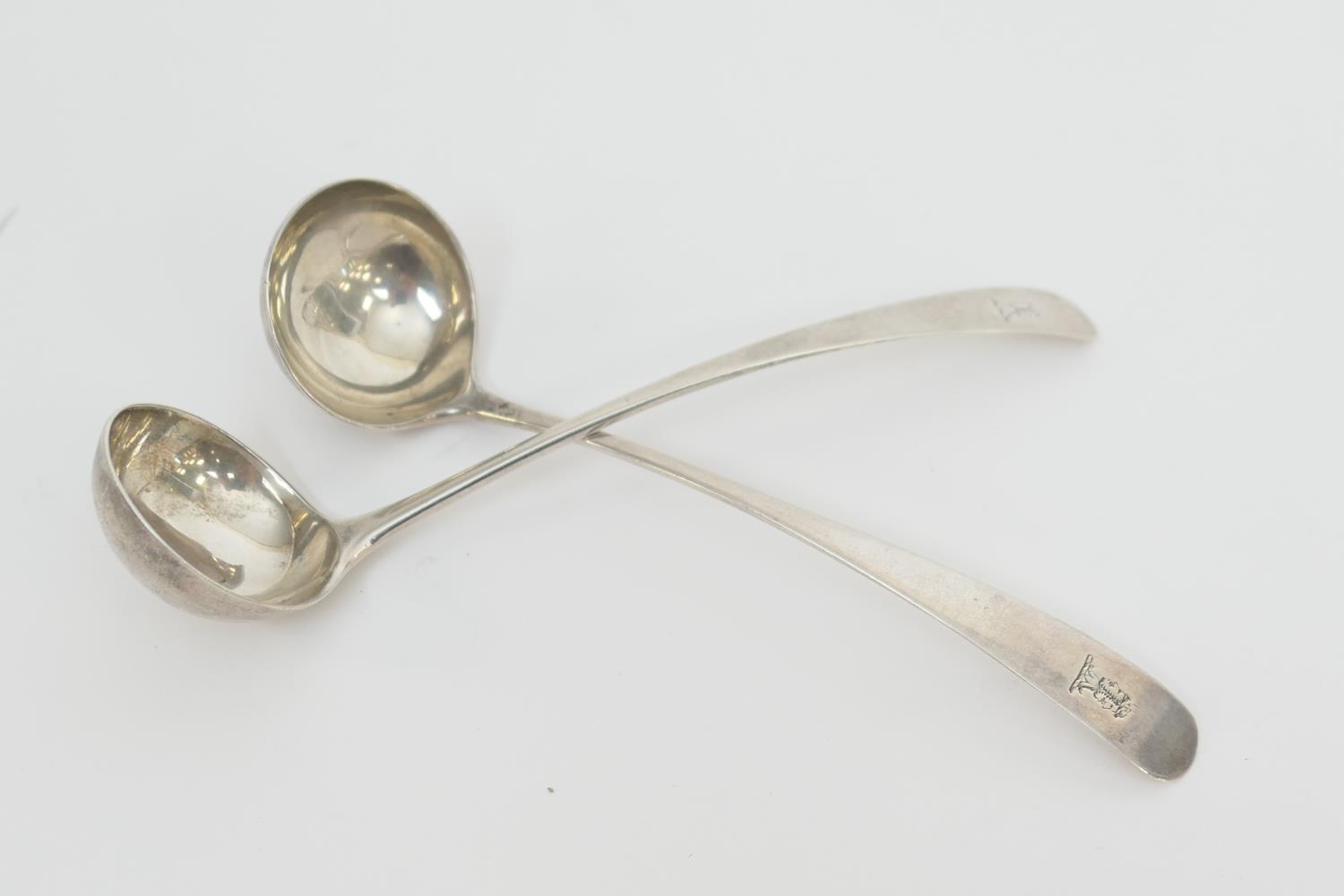 Pair of Scottish silver toddy ladles, by John Ziegler, Edinburgh 1805, each carved with the crest of