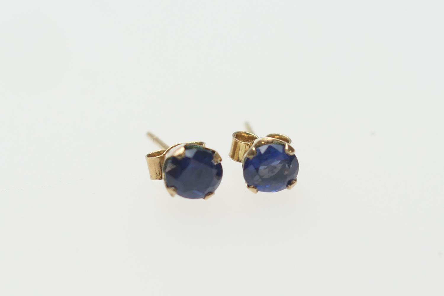 Pair of sapphire ear studs, the oval cut stones of approx. 0.5ct, mounted in 9ct yellow gold,