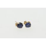 Pair of sapphire ear studs, the oval cut stones of approx. 0.5ct, mounted in 9ct yellow gold,