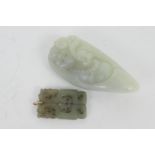 Chinese carved jade pendant, 55mm x 34mm; also a celadon jadeite pebble, carved with a happy Buddha,