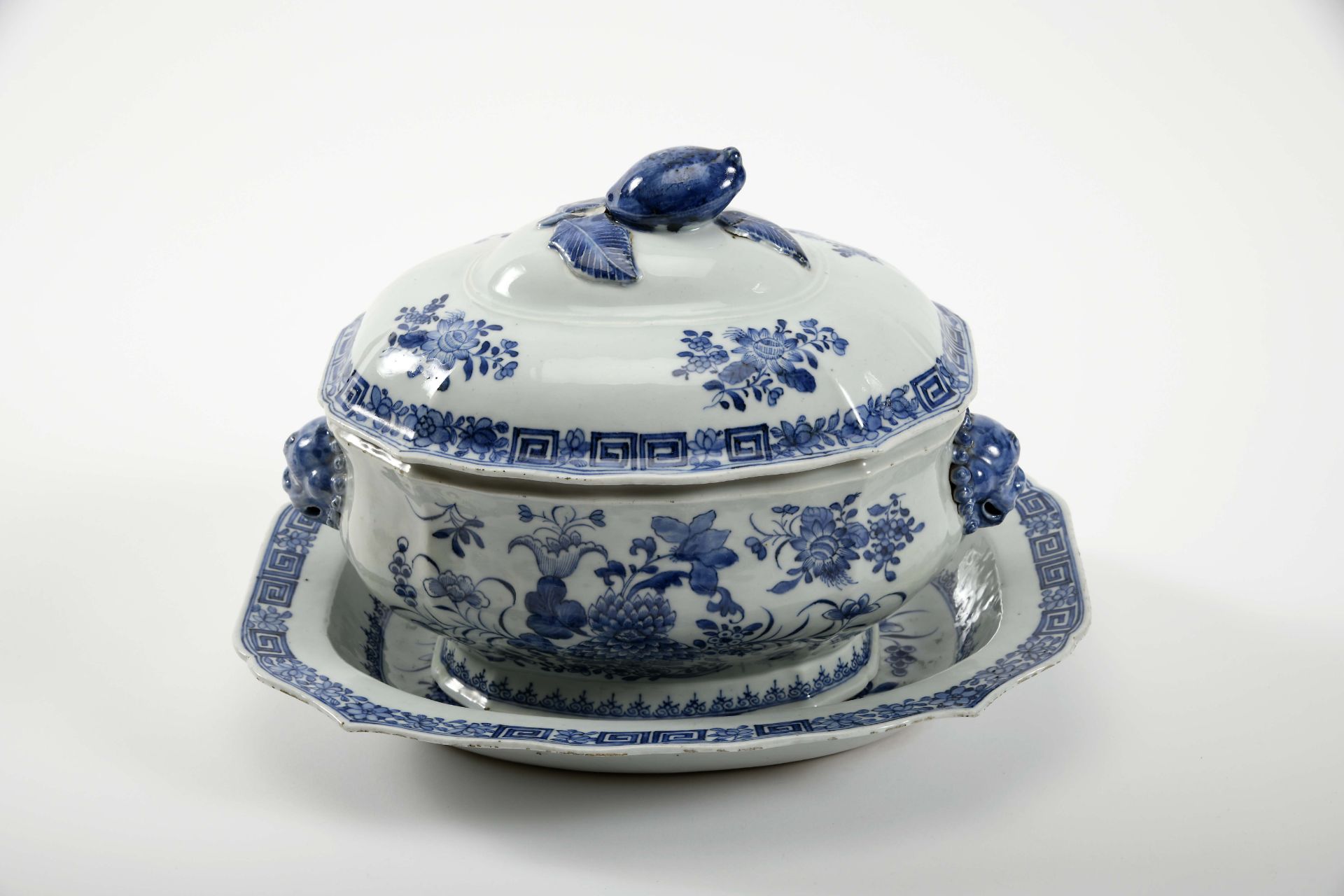 A scalloped tureen with stand