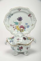 A "Chapeau chinois" tureen with four feet and scalloped stand