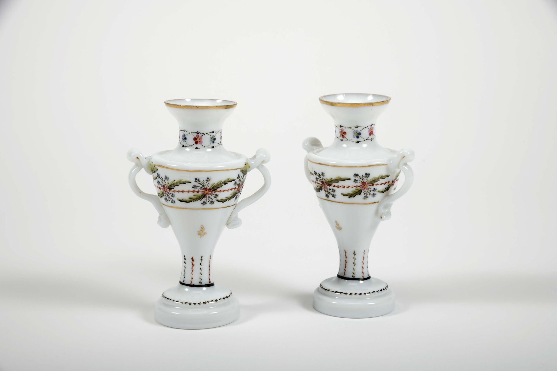A pair of vases with handles