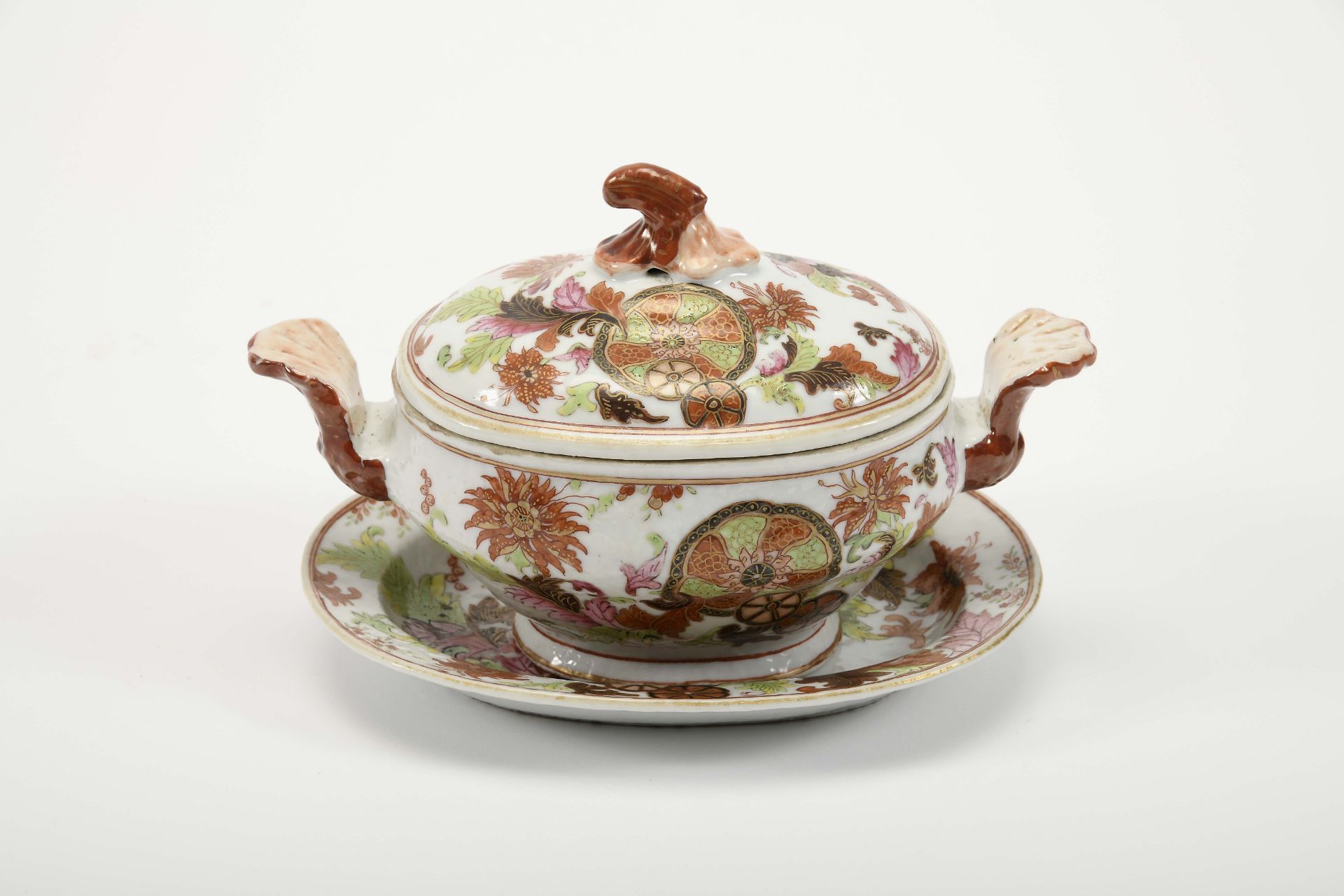A small tureen with an oval stand