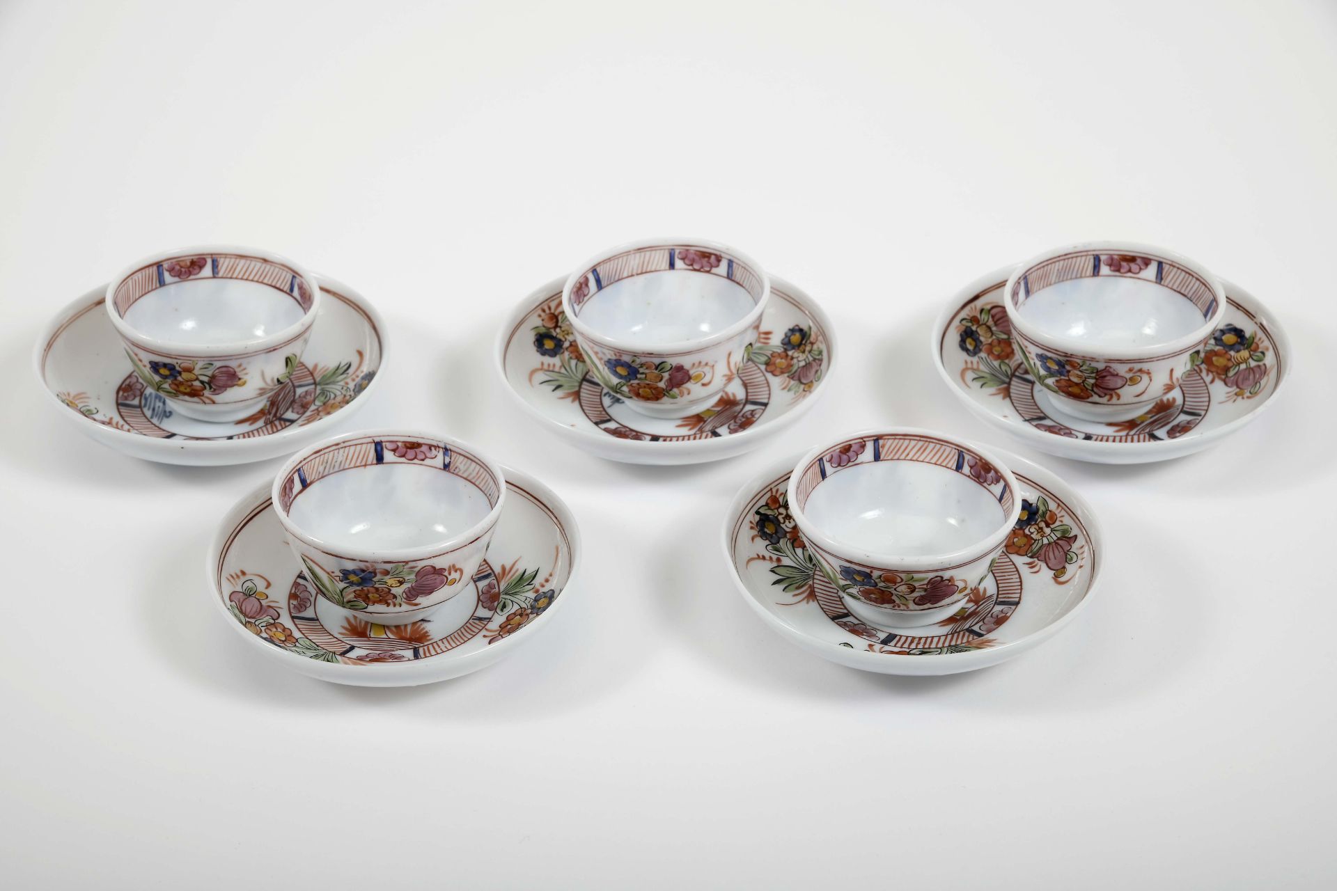 Set of five cups and saucers