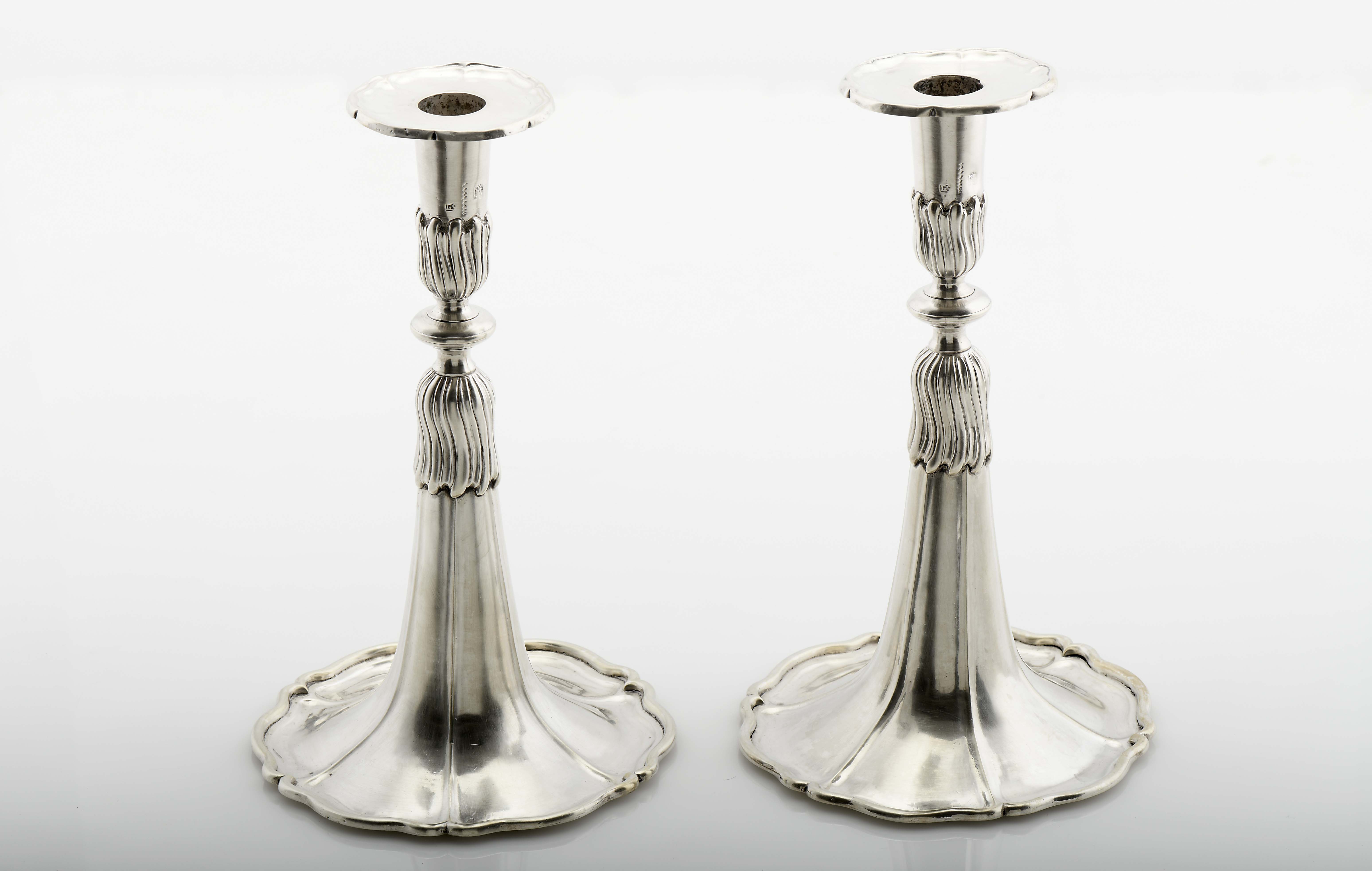 A pair of skirt candlesticks