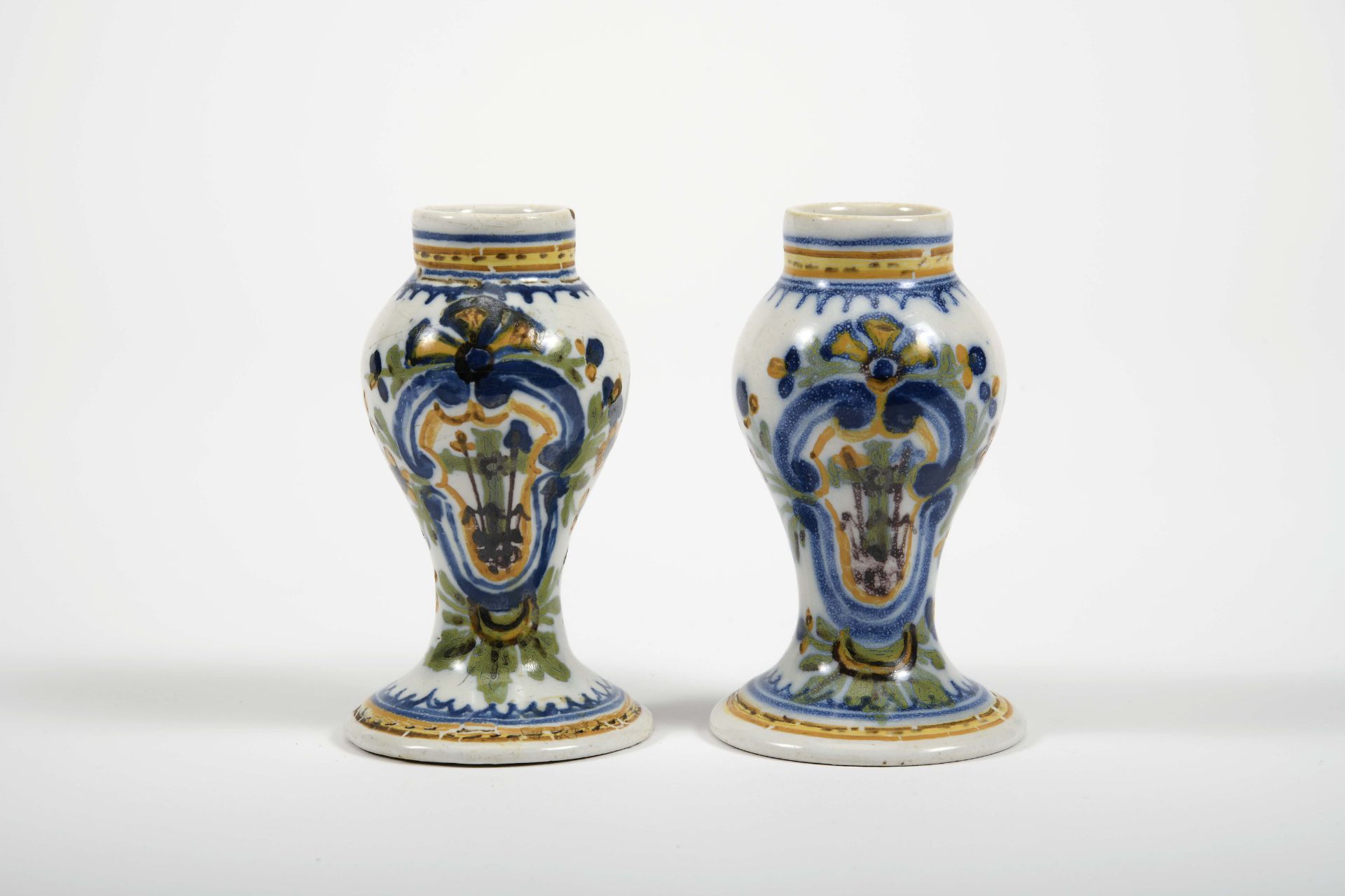 A pair of small potted vases
