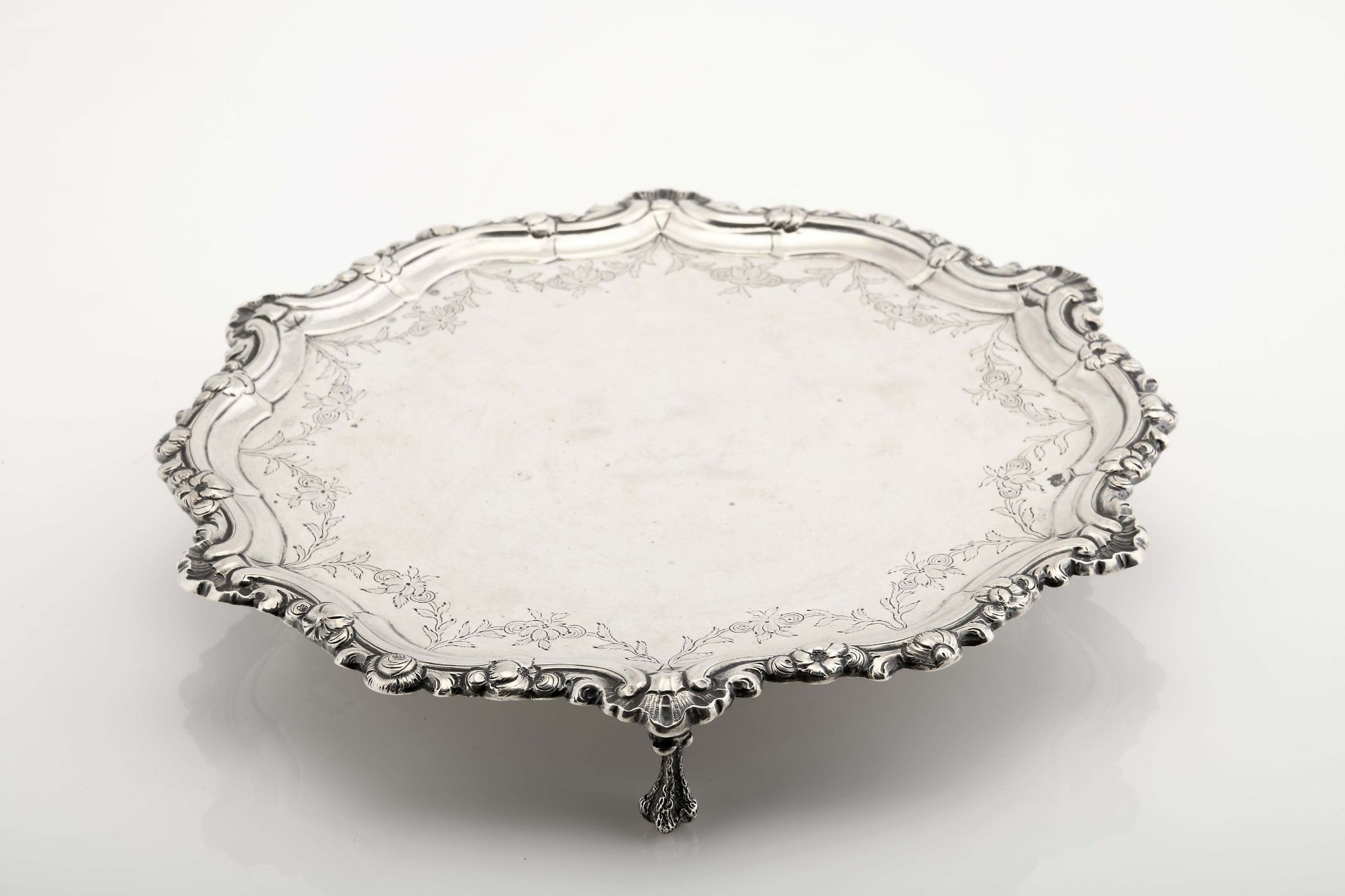 A scalloped three-footed salver (originally a card tray)