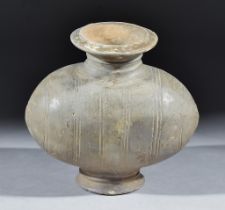 A Chinese Pottery Cocoon Jar, Han Dynasty, incised with eight bands of triple lines on circular