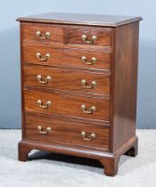 A George III Figured Mahogany Chest, with moulded edge to top, fitted two short and four long