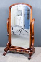 A Victorian Mahogany Framed Cheval Mirror, with moulded frame, inset with bevelled mirror plate,